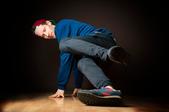 attractive male street dancer perform break dance footwork b