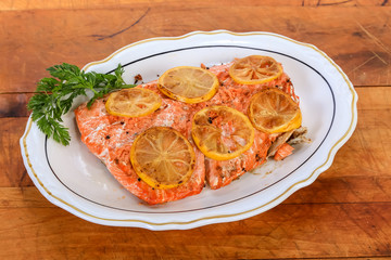 Baked Salmon Steak  basted in Lemon Butter and Topped with Lemon Slices