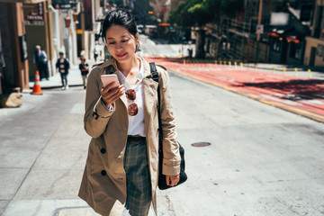 chinese lady holding smartphone texting message