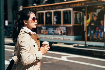 young girl commuter standing on street