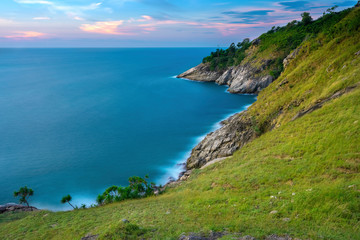 Fototapeta na wymiar Sea and cape foreground with long exposure shot when sunset. Shot at Krating Cape, Phuket, Thailand.