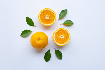 Fresh orange  with green leaves on white background.