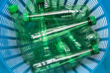 Plastic bottles in waste basket.