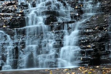 Cascading Waterfall in Autumn