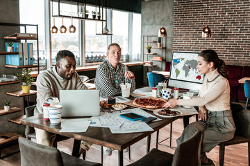 Group of young colleagues having dinner together