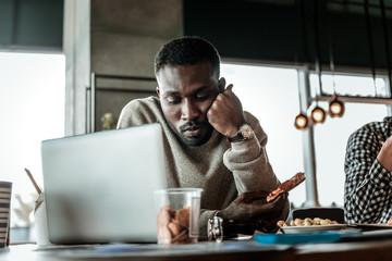 Serious international man being deep in thoughts