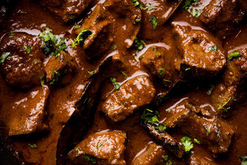 Mutton Liver fry or Kaleji masala, popular Non vegetarian recipe from India and Pakistan. served dry or with curry in a bowl, karahi or plate