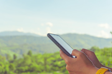 Woman hand using smartphone.