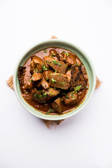 Mutton Liver fry or Kaleji masala, popular Non vegetarian recipe from India and Pakistan. served dry or with curry in a bowl, karahi or plate