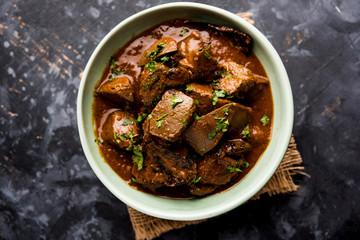 Mutton Liver fry or Kaleji masala, popular Non vegetarian recipe from India and Pakistan. served dry or with curry in a bowl, karahi or plate