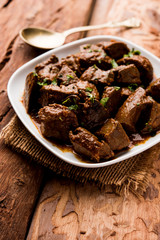 Mutton Liver fry or Kaleji masala, popular Non vegetarian recipe from India and Pakistan. served dry or with curry in a bowl, karahi or plate