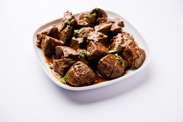 Mutton Liver fry or Kaleji masala, popular Non vegetarian recipe from India and Pakistan. served dry or with curry in a bowl, karahi or plate