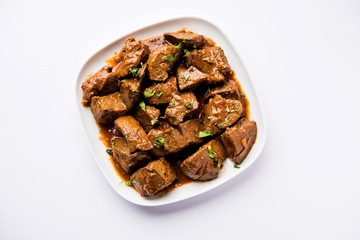 Mutton Liver fry or Kaleji masala, popular Non vegetarian recipe from India and Pakistan. served dry or with curry in a bowl, karahi or plate
