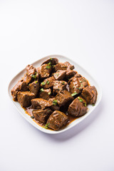 Mutton Liver fry or Kaleji masala, popular Non vegetarian recipe from India and Pakistan. served dry or with curry in a bowl, karahi or plate
