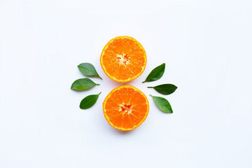 Orange fruits and green leaves on a white background.