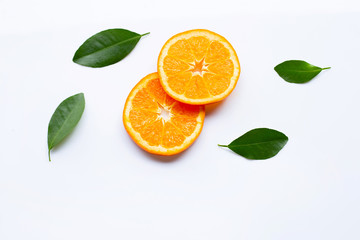 Fototapeta premium Fresh orange citrus fruits with leaves on white background.