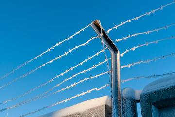 The restricted area is fenced with barbed wire.