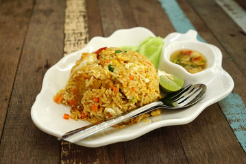 Shrimp fried rice serving with fresh vegetable on white  plate