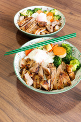 Roast pork with rice and eggs with vegetable Japanese.
