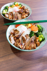 Roast pork with rice and eggs with vegetable Japanese.