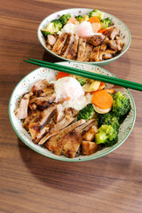 Roast pork with rice and eggs with vegetable Japanese.