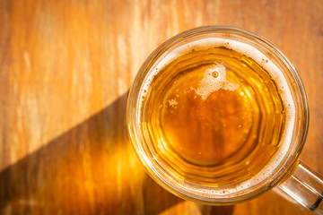 top view glass of beer on wooden table