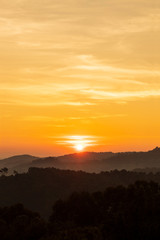 Fototapeta na wymiar silhouette of mountains with sunrise background