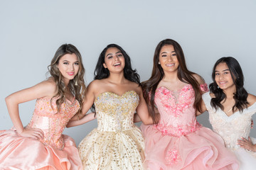 Four Hispanic Girls In Quinceanera Dresses - obrazy, fototapety, plakaty