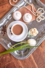 cup of tea and cookies on wooden table