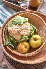 basket with ripe autumn fruits and vegetables