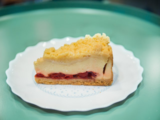 Strawberry crumble cake pie on white plate