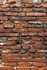 Old orange brick wall, close up.