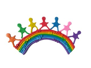 Lovely children standing on rainbow made from multicolored plasticine clay on white background, variety color dough, No matter how different colorful each other, it can create beauty natural