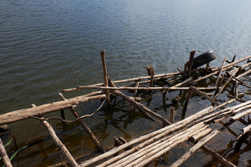 The pier is broken at the water's edge