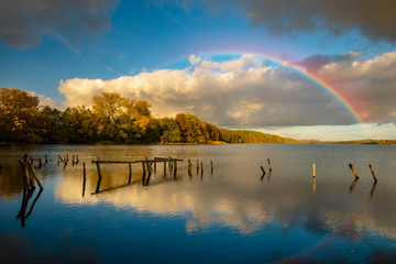 rainbow over the lake on an autumn evening