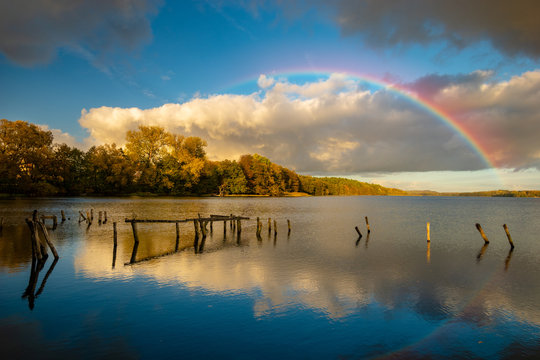 Rainbow Over The Lake On An Autumn Evening