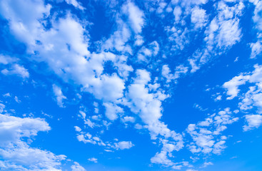 Fototapeta na wymiar blue sky background with tiny clouds.