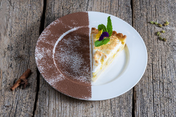 A piece of appetizing cake with apples, homemade prepared on a white plate