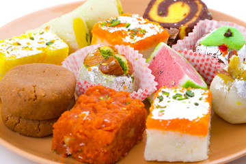 Indian Traditional Mix Sweet Food or Mix Mithai include Peda, Mawa Burfi, Dry Fruits Sweet, Halwa or Coconut Burfi
