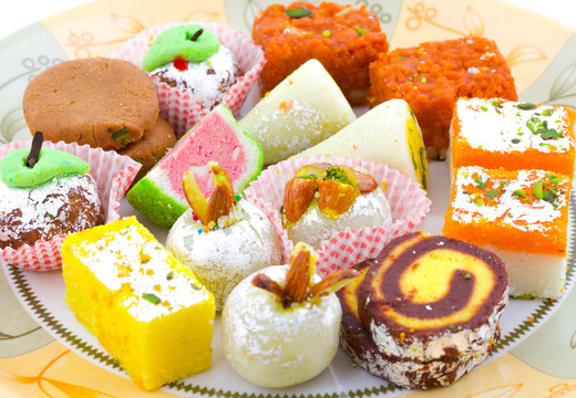 Indian Traditional Mix Sweet Food or Mix Mithai include Peda, Mawa Burfi, Dry Fruits Sweet, Halwa or Coconut Burfi