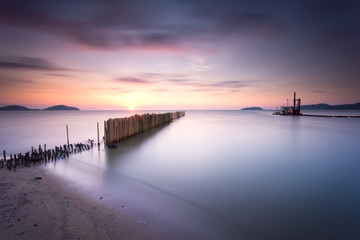 Fototapeta na wymiar Long exposure at sunrise of seascape in Phuket Thailand.