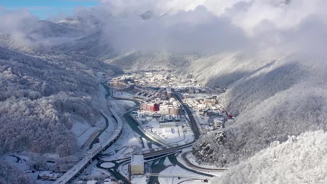 Aerial view of ski resort Gorky Gorod in Caucasus Mountains, Sochi, Russia. Mountain roads from above.