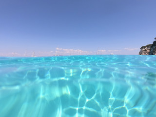 Fototapeta na wymiar Underwater photo of mediterranean paradise island sandy beach with turquoise clear sea