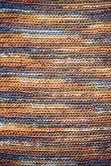 Hand made snug cozy knitting textile background, wool scarf texture