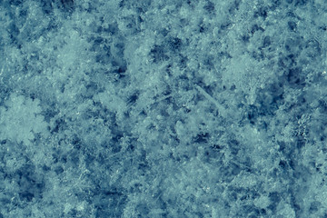Fototapeta na wymiar Cold snowy icy blue background. Cold winter weather texture. Snowflakes abstract background