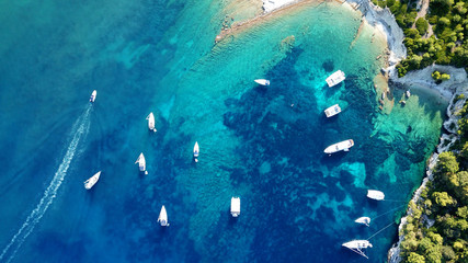 Aerial drone photo of tropical caribbean bay with white sand beach and beautiful turquoise and sapphire clear sea