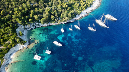 Aerial drone photo of tropical caribbean bay with white sand beach and beautiful turquoise and sapphire clear sea