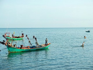 Naklejka na ściany i meble fishing boat in cambodia