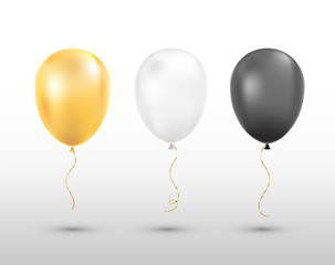 Black, white and golden balloons isolated. 