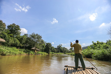 Bamboo rafting on river in jungle, Chiang Mai 